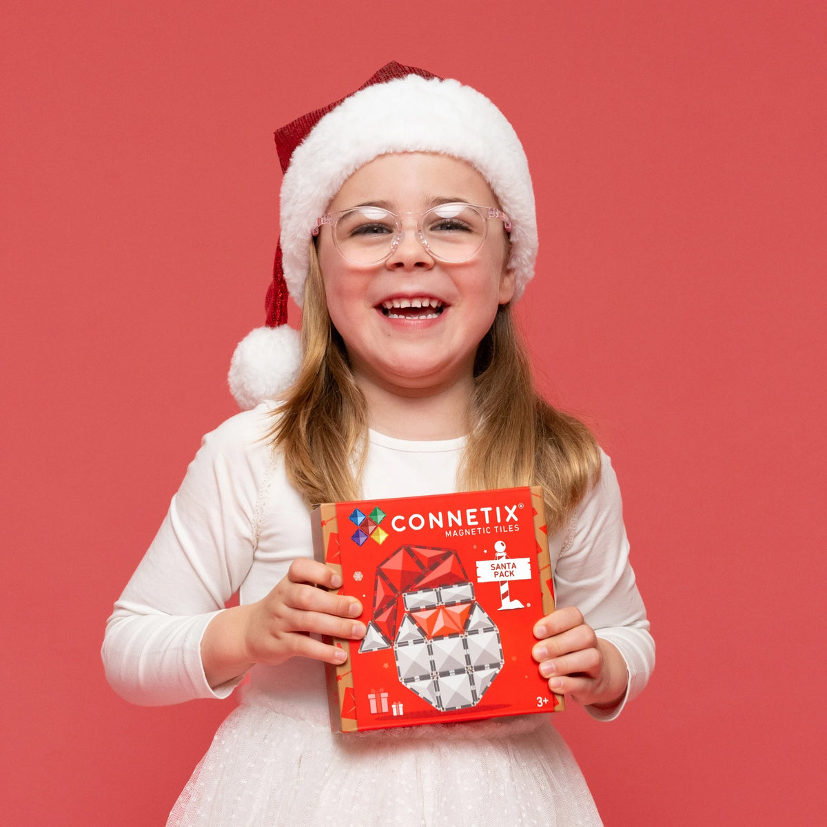 Child in Santa hat with Connetix Christmas Santa Pack