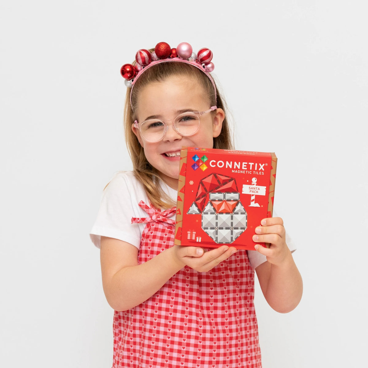 Child holding Connetix Christmas Santa Pack