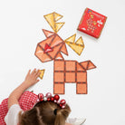 Child building a reindeer with Connetix tiles